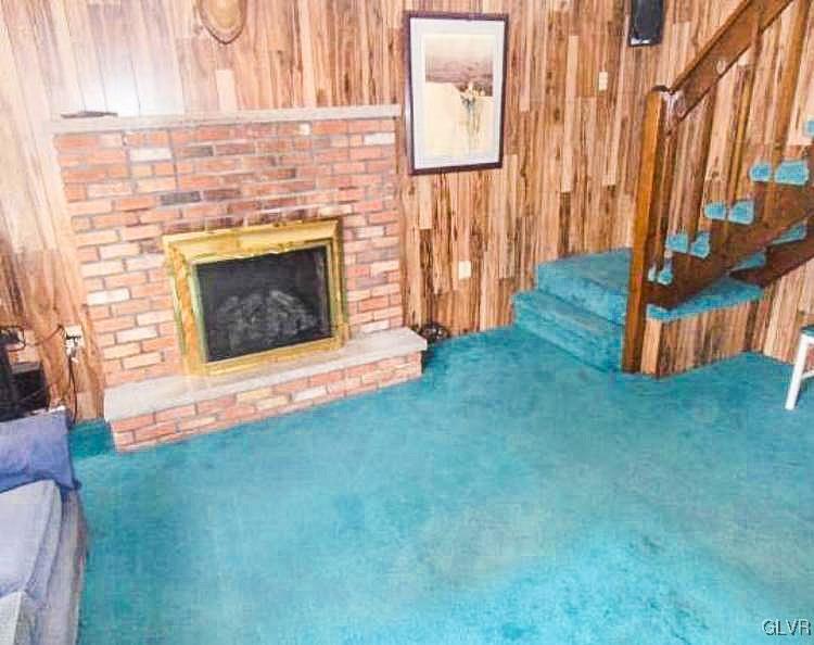 124 Bull Run Long Pond, PA 18334 - Photo 9 of 13 a view of an empty room with wooden floor and a fireplace