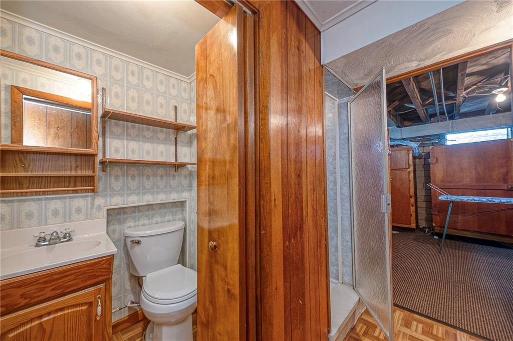 699 Kaye Avenue Monaca, PA 15061 - Photo 25 of 43 a bathroom with a toilet a sink and a window