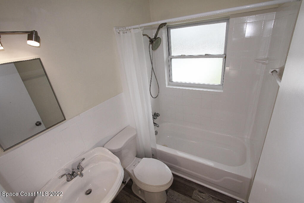 114 1st Street Merritt Island, FL 32953 - Photo 13 of 21 a bathroom with a toilet and a shower