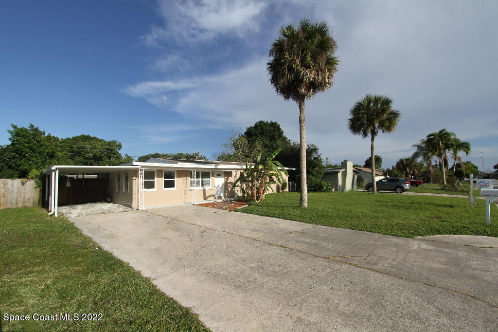 114 1st Street Merritt Island, FL 32953 - Photo 2 of 21 a view of house with outdoor space and trees