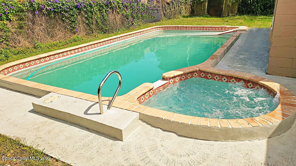 114 1st Street Merritt Island, FL 32953 - Photo 21 of 21 a view of a swimming pool with a yard and sitting area
