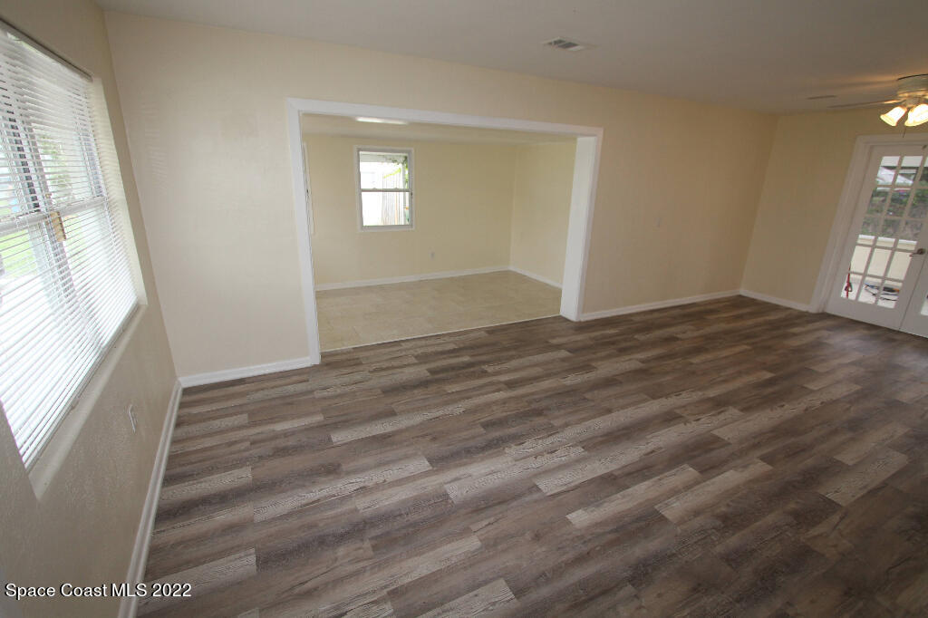 114 1st Street Merritt Island, FL 32953 - Photo 5 of 21 a view of an empty room and window