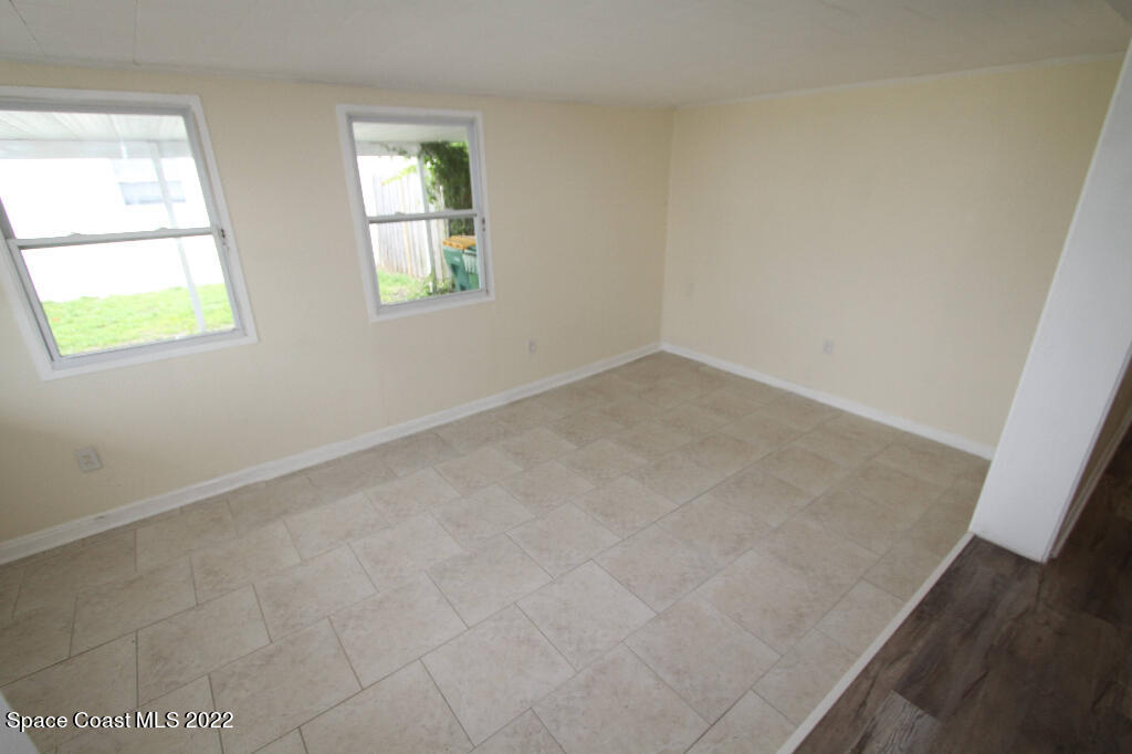 114 1st Street Merritt Island, FL 32953 - Photo 6 of 21 an empty room with windows