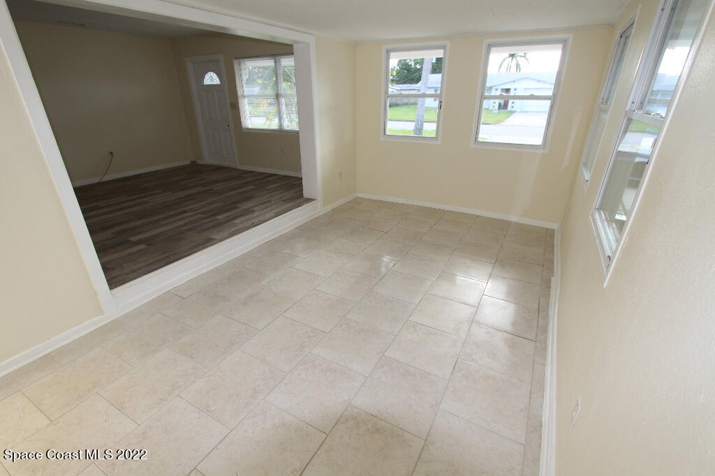 114 1st Street Merritt Island, FL 32953 - Photo 7 of 21 a view of an empty room and window