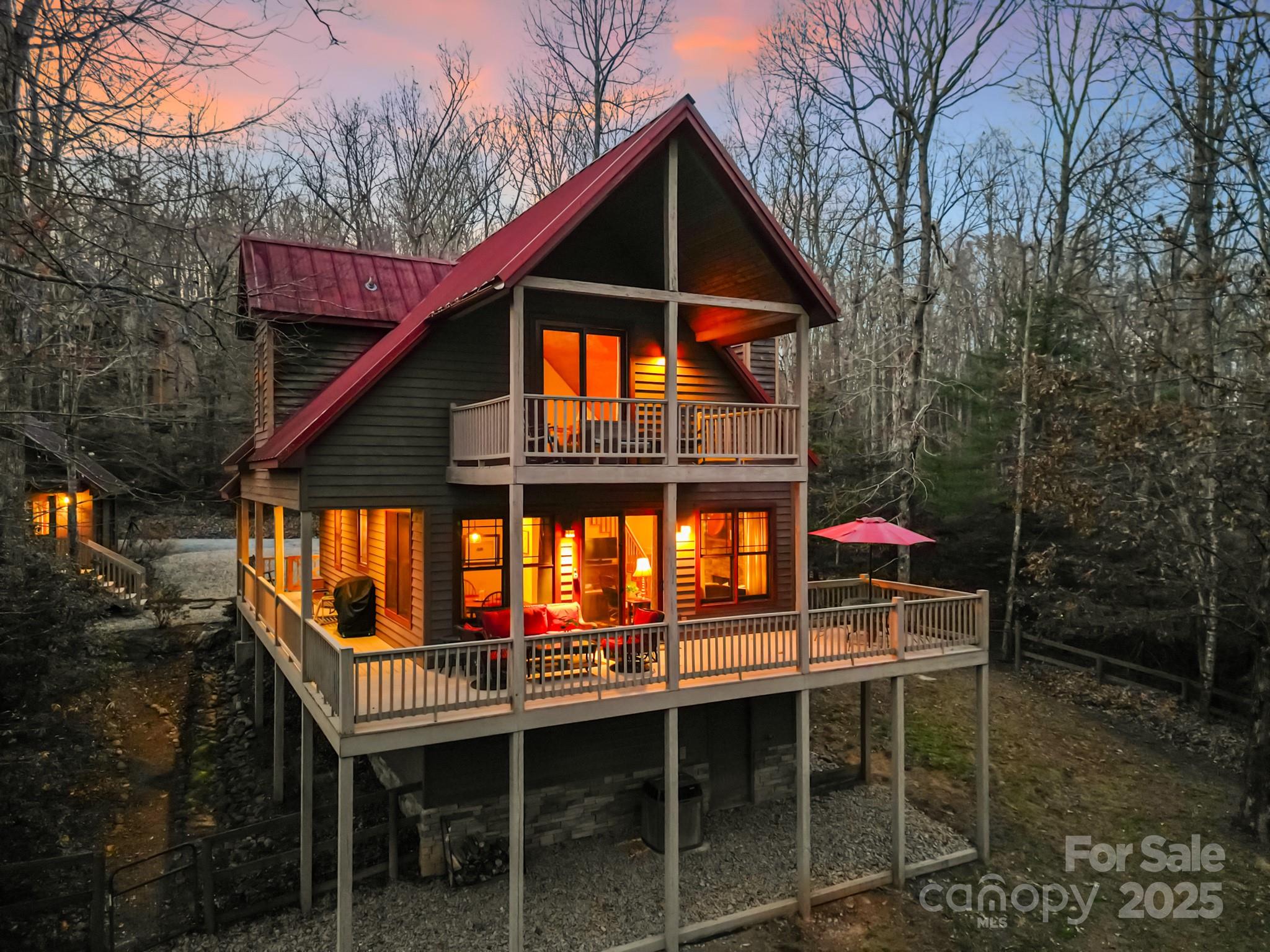 a view of house with a roof deck