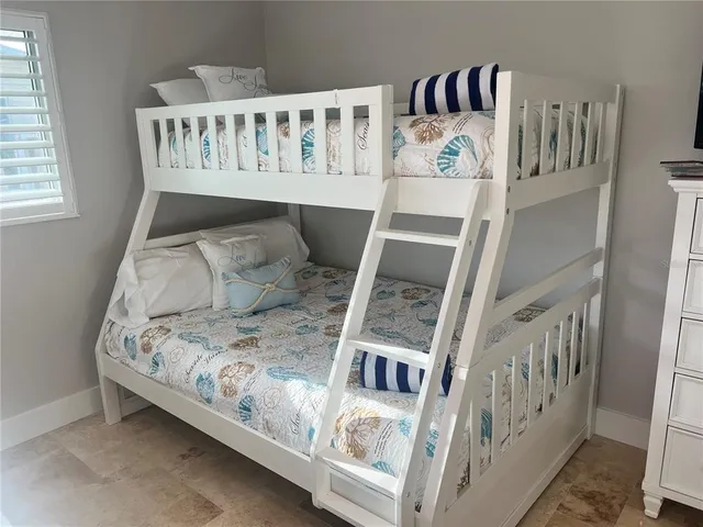 a view of a bedroom with furniture