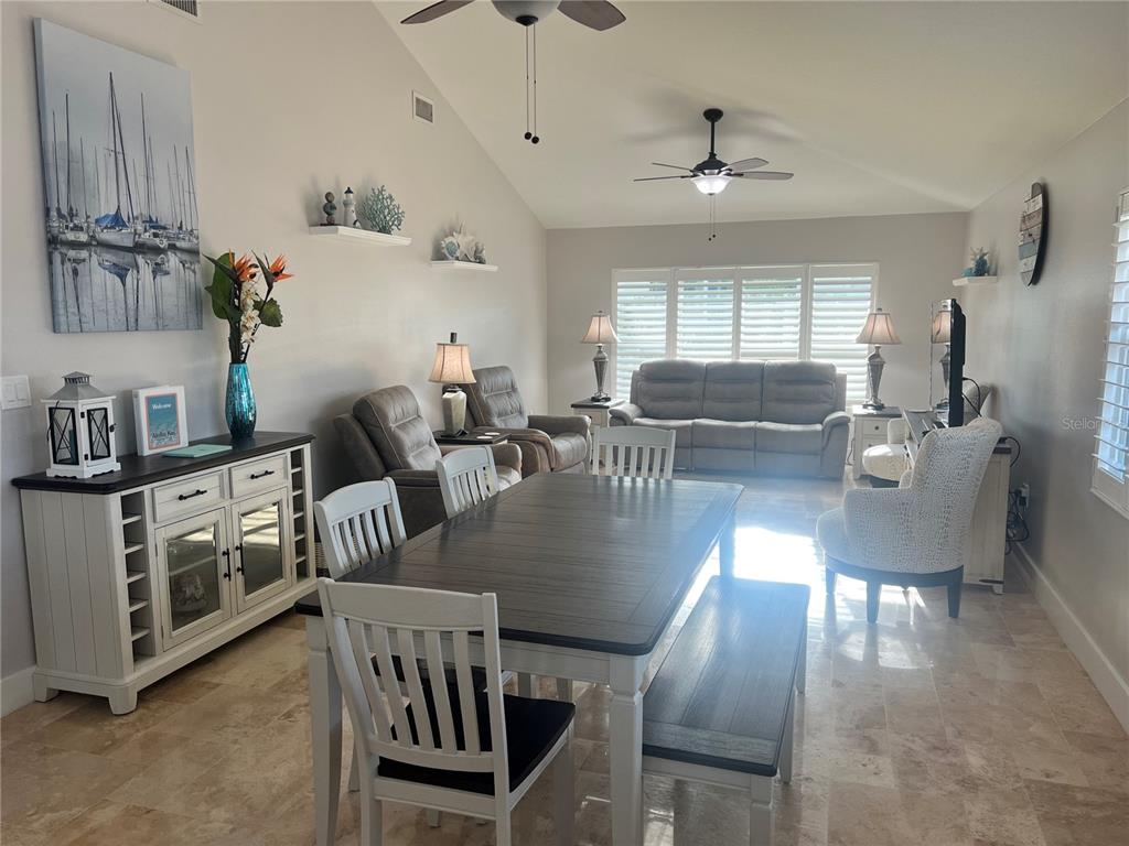 6020 Midnight Pass Road, Unit 22 Sarasota, FL 34242 - Photo 2 of 21 a living room with furniture and a window