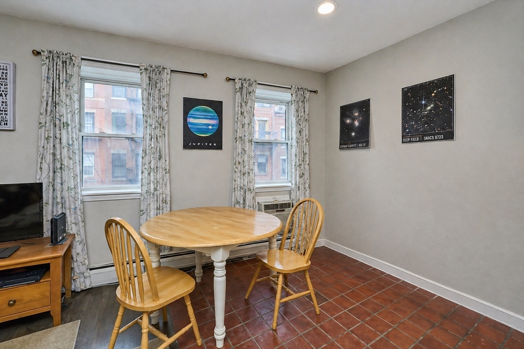 250 North Street, Unit 3 Boston, MA 02113 - Photo 5 of 11 a view of a dining room with furniture and a window