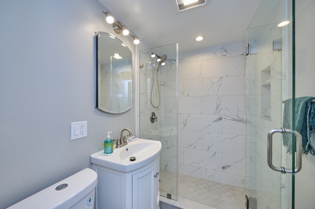 250 North Street, Unit 3 Boston, MA 02113 - Photo 8 of 11 a bathroom with a sink a toilet and shower