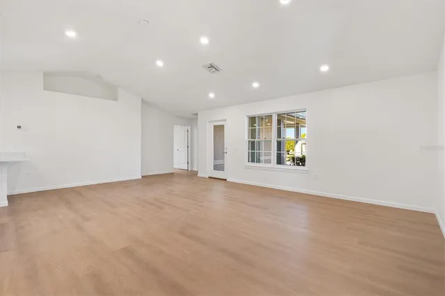 an empty room with entrance and an empty room