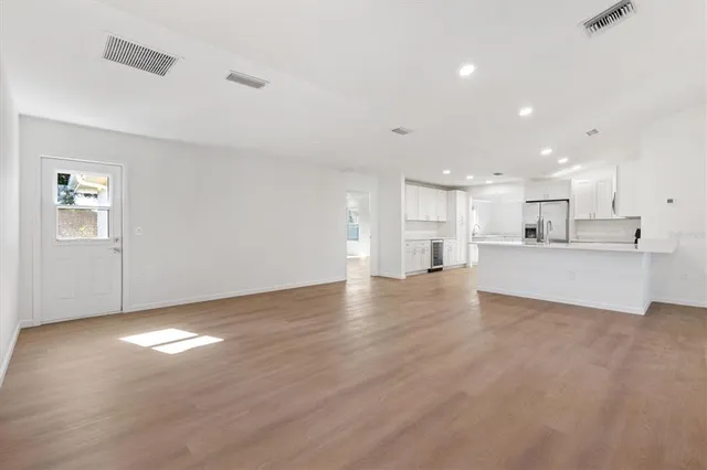 a view of a kitchen with a sink and a window