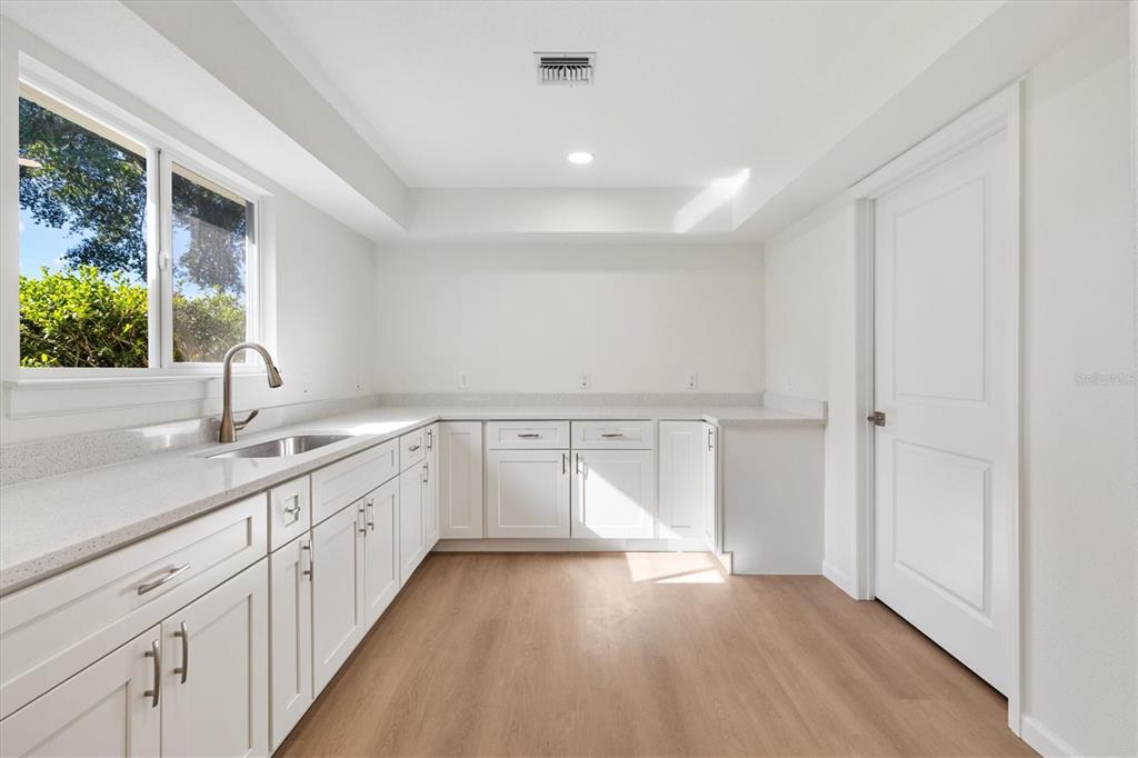 11041 Southeast 174th Loop Summerfield, FL 34491 - Photo 20 of 43 a view of a kitchen with a sink and windows