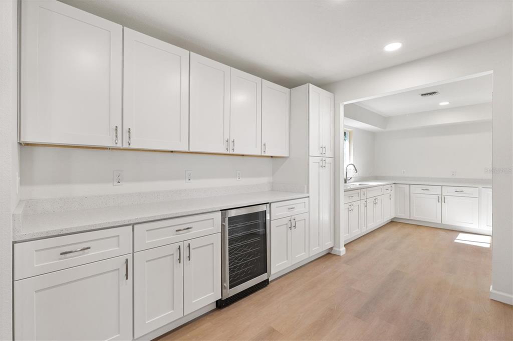 11041 Southeast 174th Loop Summerfield, FL 34491 - Photo 22 of 43 a kitchen with white cabinets