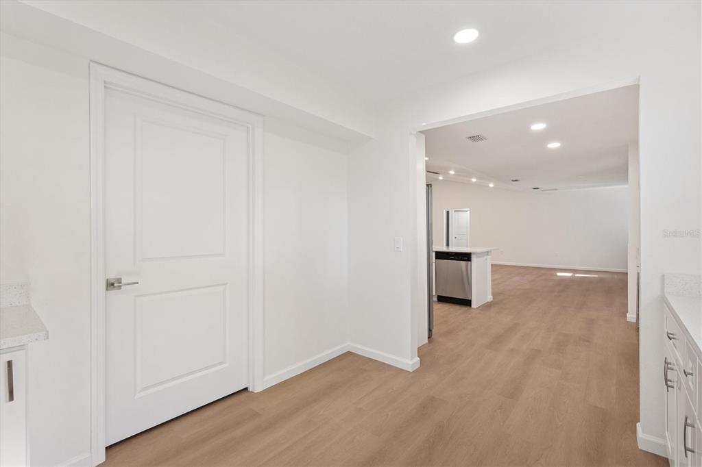 11041 Southeast 174th Loop Summerfield, FL 34491 - Photo 23 of 43 wooden floor in an empty room with a bathroom