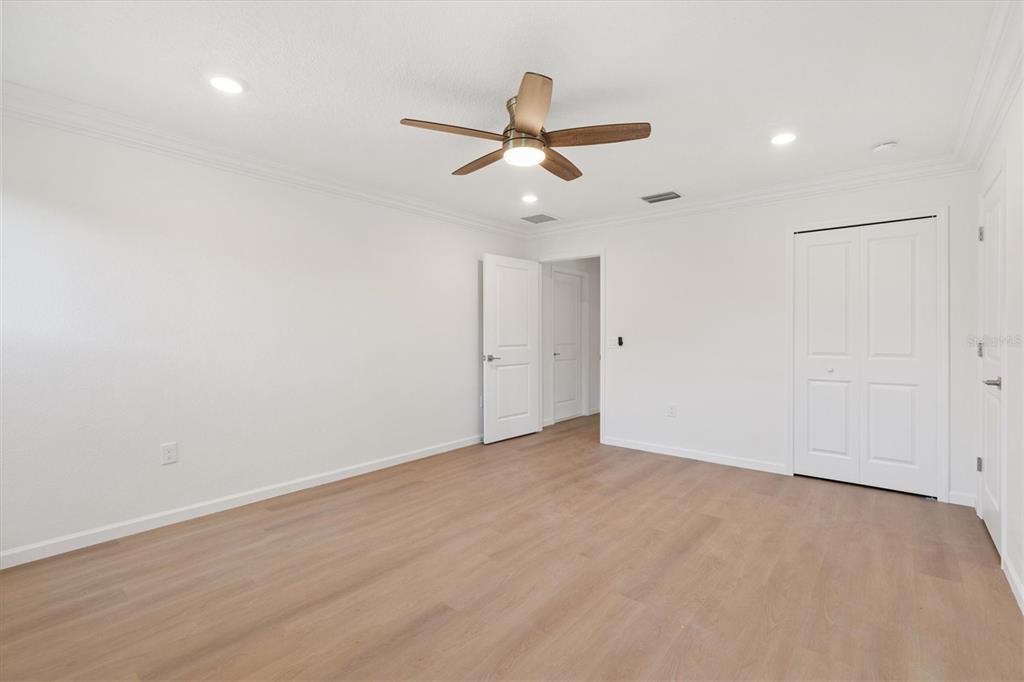 11041 Southeast 174th Loop Summerfield, FL 34491 - Photo 36 of 43 an empty room with ceiling fan and window