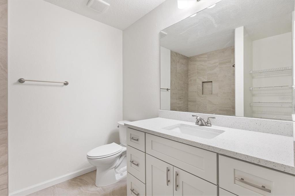 11041 Southeast 174th Loop Summerfield, FL 34491 - Photo 38 of 43 a bathroom with a toilet sink and mirror