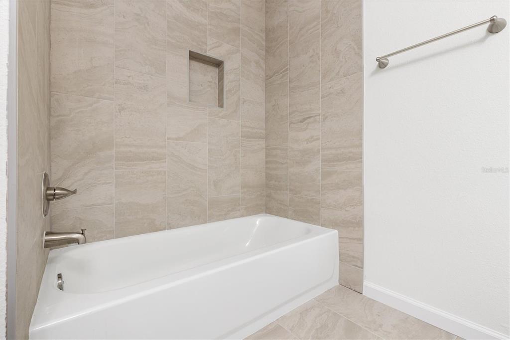 11041 Southeast 174th Loop Summerfield, FL 34491 - Photo 39 of 43 a bathroom with a bathtub