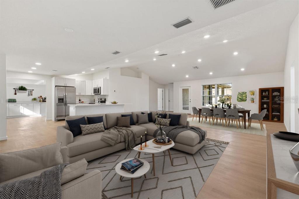 11041 Southeast 174th Loop Summerfield, FL 34491 - Photo 5 of 43 a living room with furniture and wooden floor