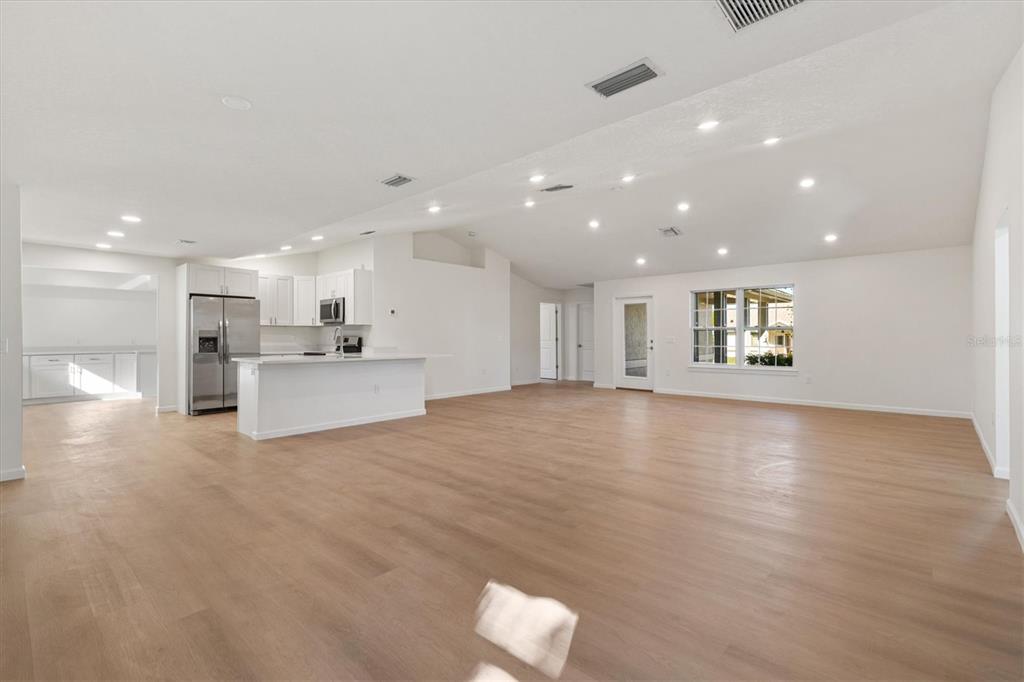 11041 Southeast 174th Loop Summerfield, FL 34491 - Photo 6 of 43 a view of an empty room with a kitchen