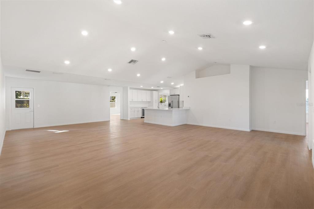 11041 Southeast 174th Loop Summerfield, FL 34491 - Photo 9 of 43 a view of empty room with kitchen and window