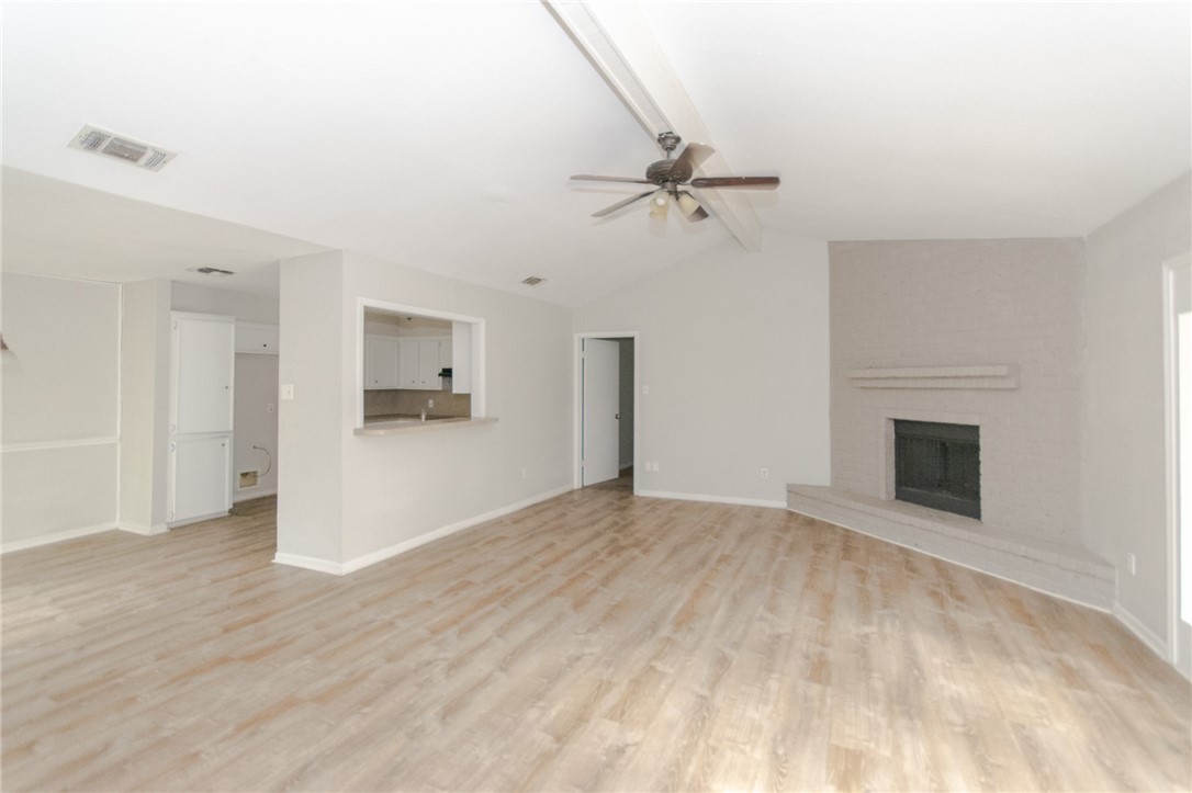 5330 Crossridge Drive Corpus Christi, TX 78413 - Photo 2 of 10 a view of empty room with wooden floor and fireplace