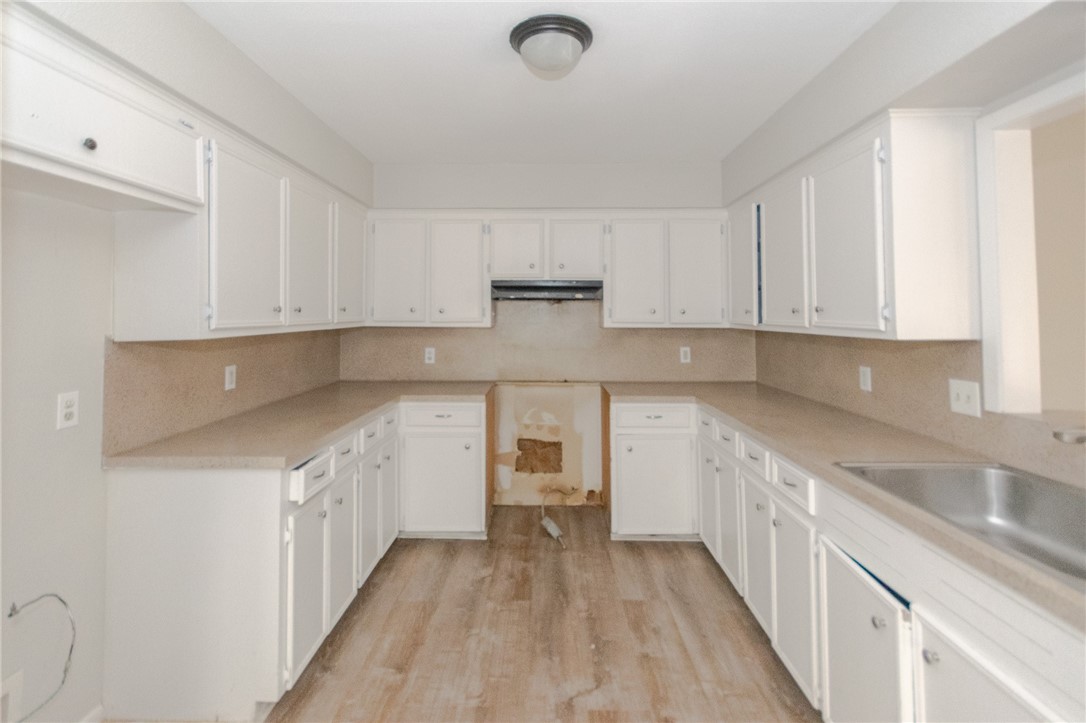5330 Crossridge Drive Corpus Christi, TX 78413 - Photo 3 of 10 a kitchen with granite countertop a sink and cabinets