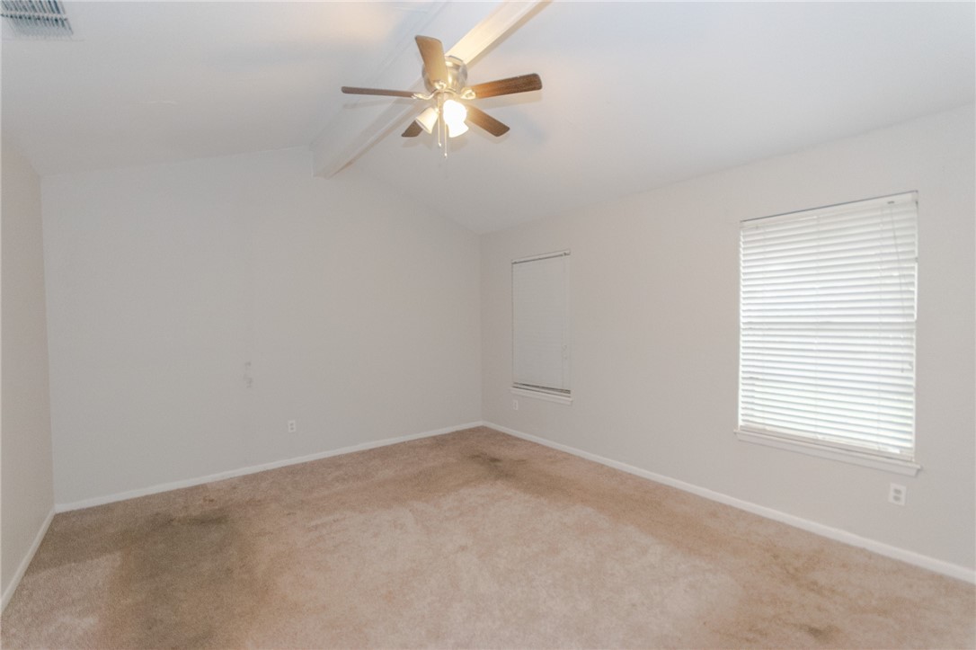 5330 Crossridge Drive Corpus Christi, TX 78413 - Photo 5 of 10 an empty room with a window and a fan