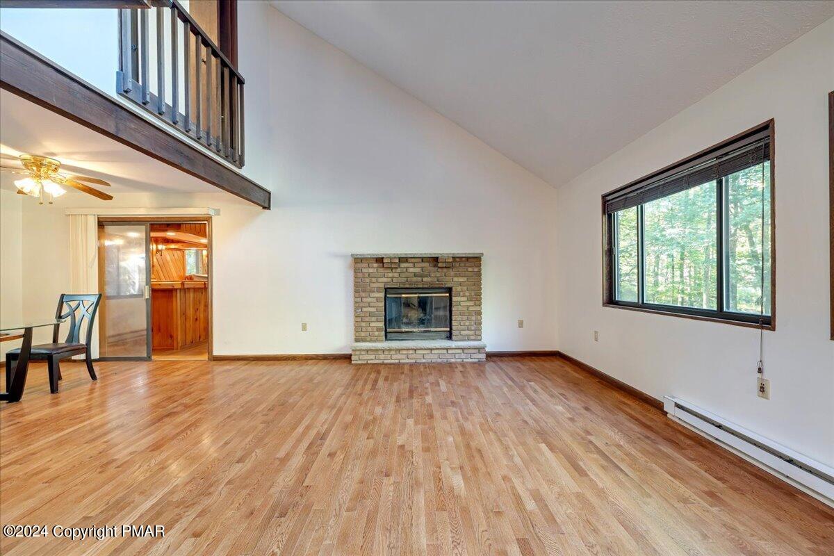 1182 Coolbaugh Road East Stroudsburg, PA 18302 - Photo 25 of 53 an empty room with wooden floor and windows