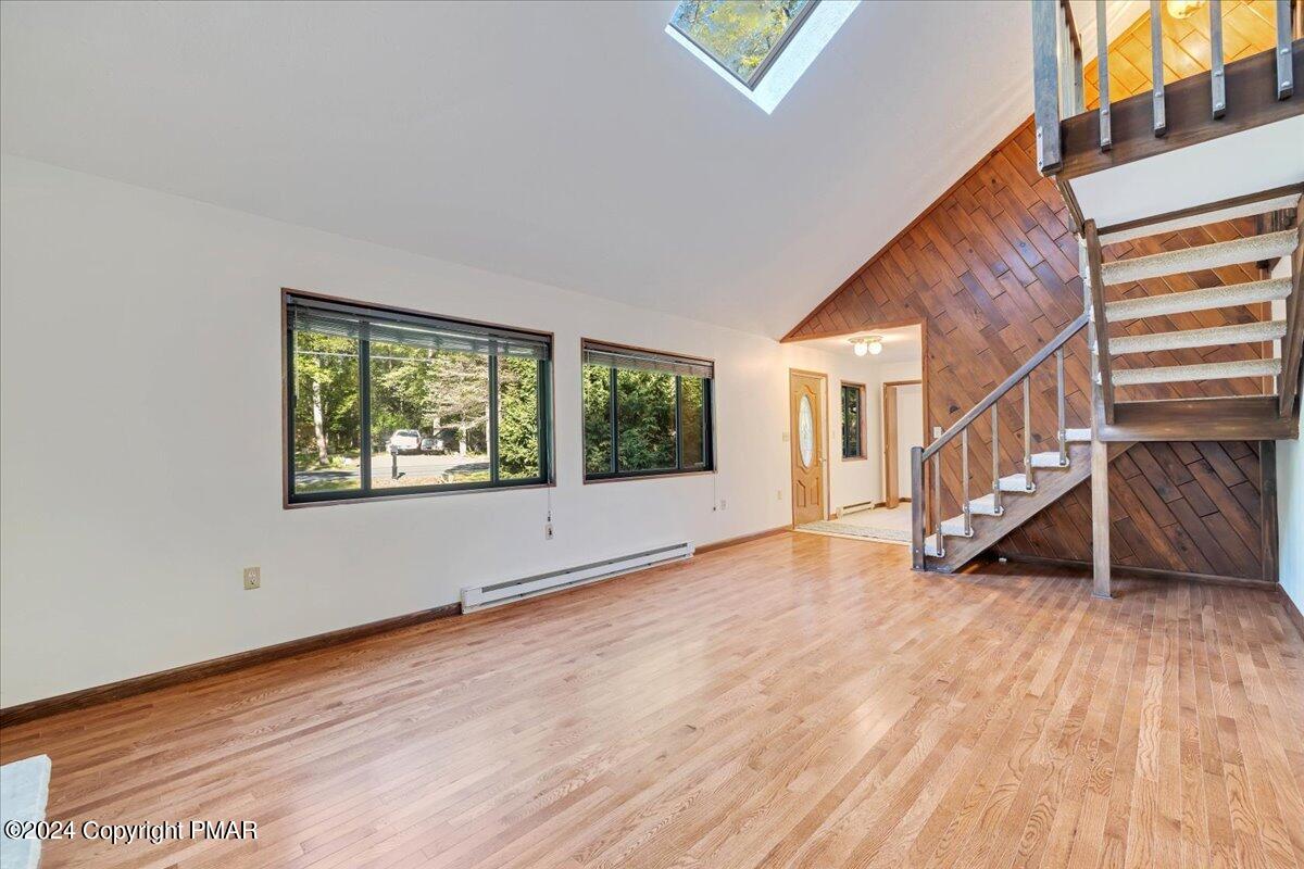 1182 Coolbaugh Road East Stroudsburg, PA 18302 - Photo 26 of 53 a view of an empty room with a window and wooden floor