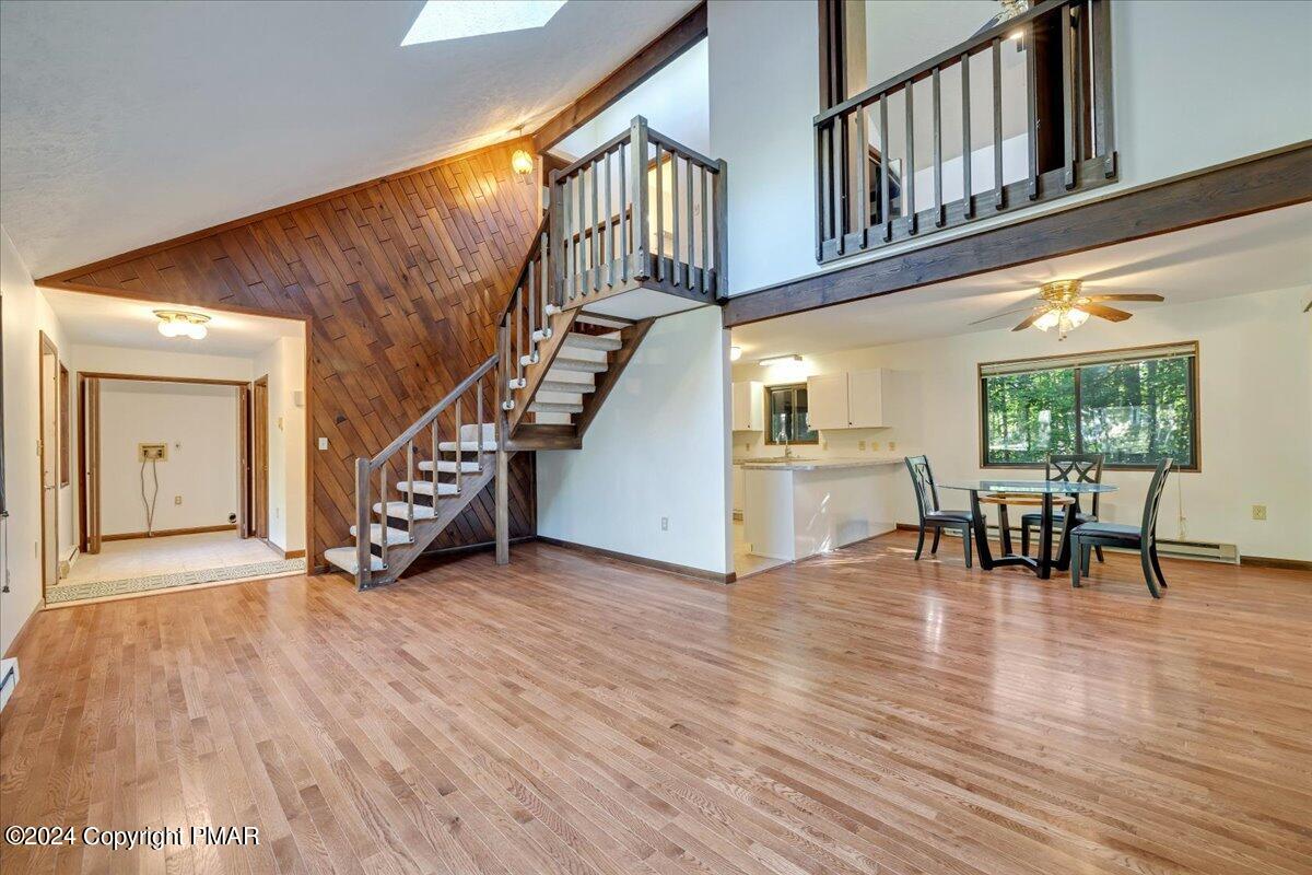 1182 Coolbaugh Road East Stroudsburg, PA 18302 - Photo 27 of 53 a view of an entryway with wooden floor stairs and a livingroom