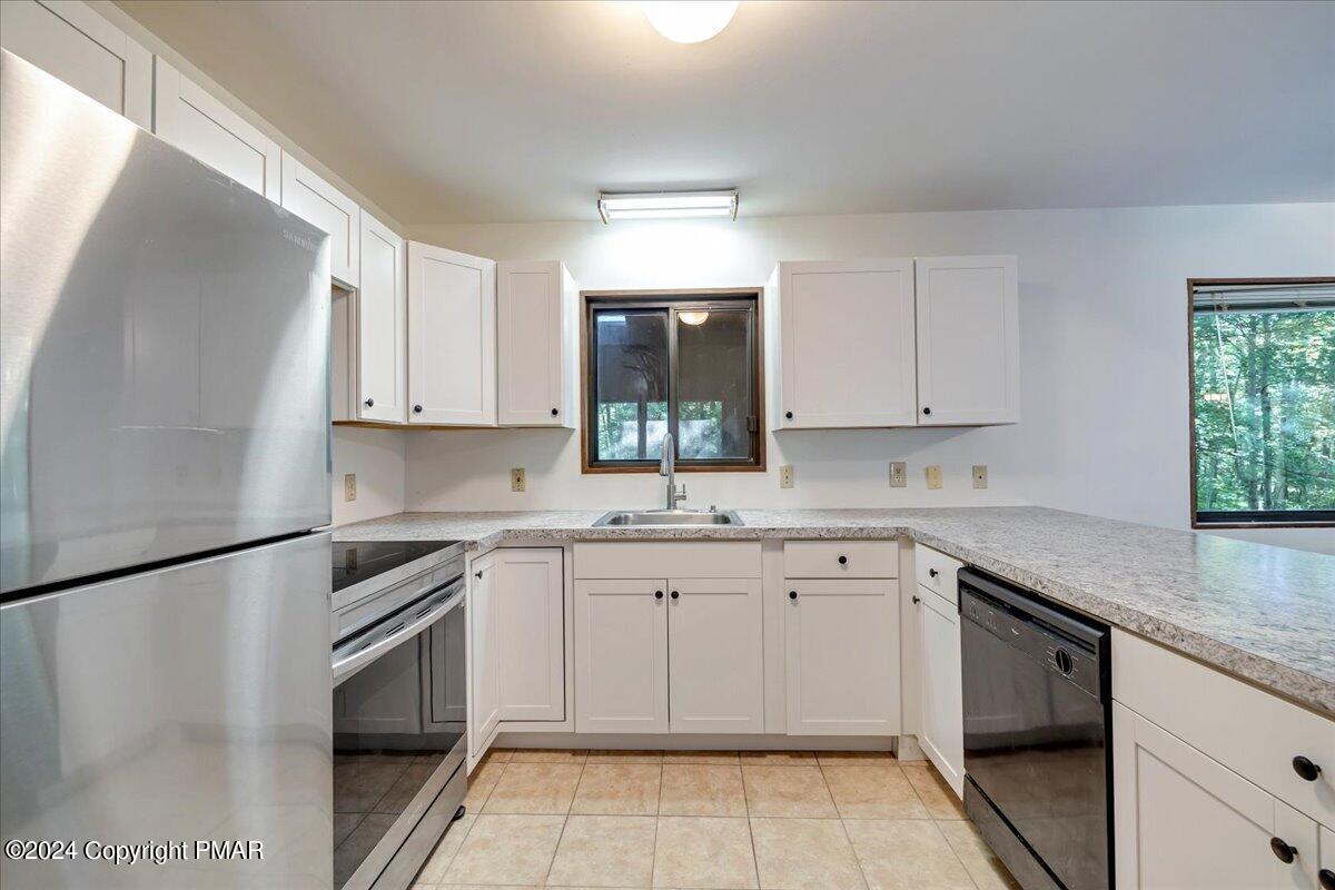 1182 Coolbaugh Road East Stroudsburg, PA 18302 - Photo 31 of 53 a kitchen with a sink stove and cabinets
