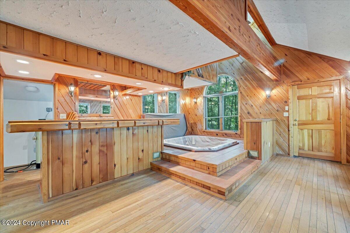 1182 Coolbaugh Road East Stroudsburg, PA 18302 - Photo 38 of 53 a spacious bedroom with a bed and large windows