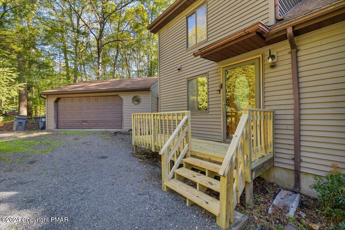 1182 Coolbaugh Road East Stroudsburg, PA 18302 - Photo 4 of 53 a view of a house with a yard and wooden fence
