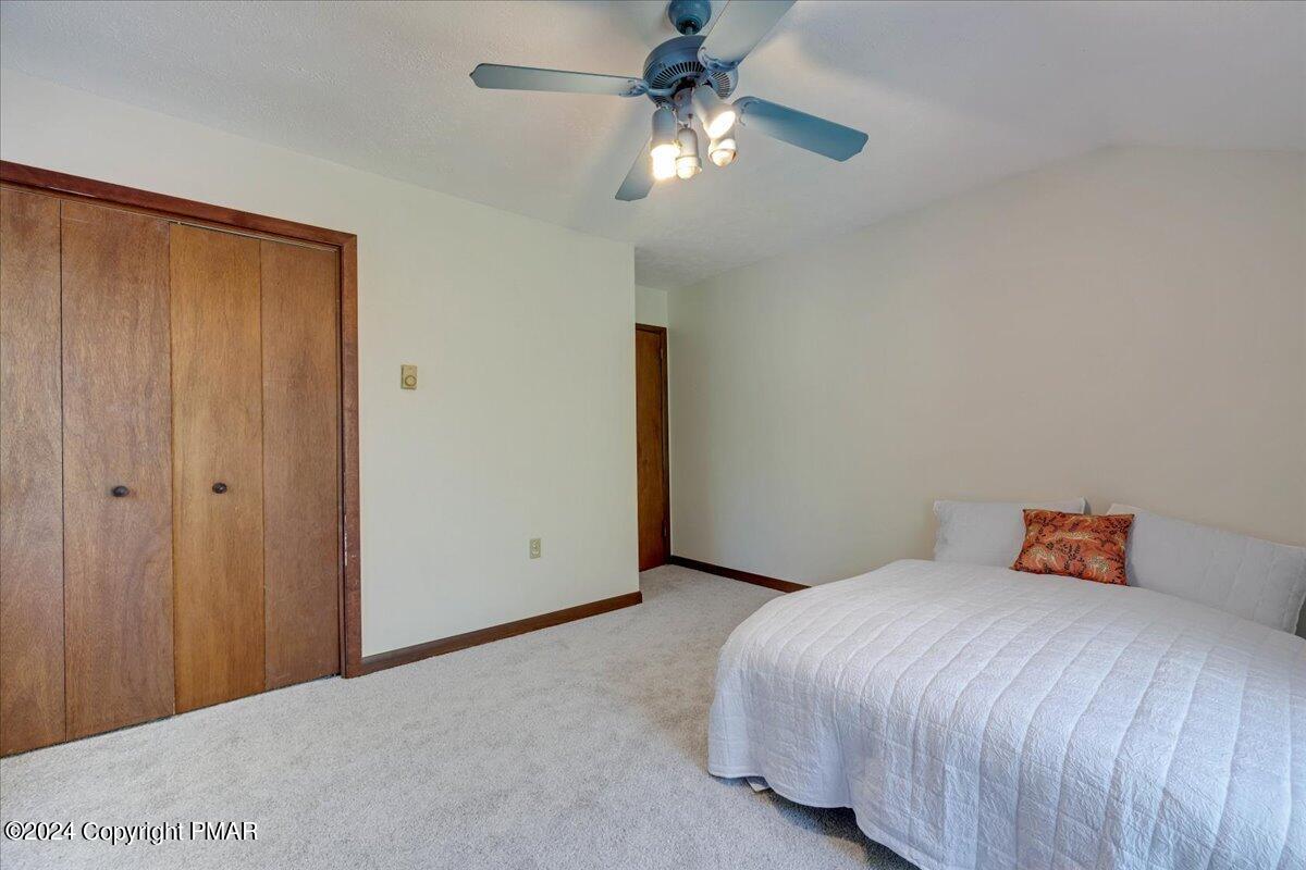 1182 Coolbaugh Road East Stroudsburg, PA 18302 - Photo 45 of 53 a bedroom with a bed and a ceiling fan