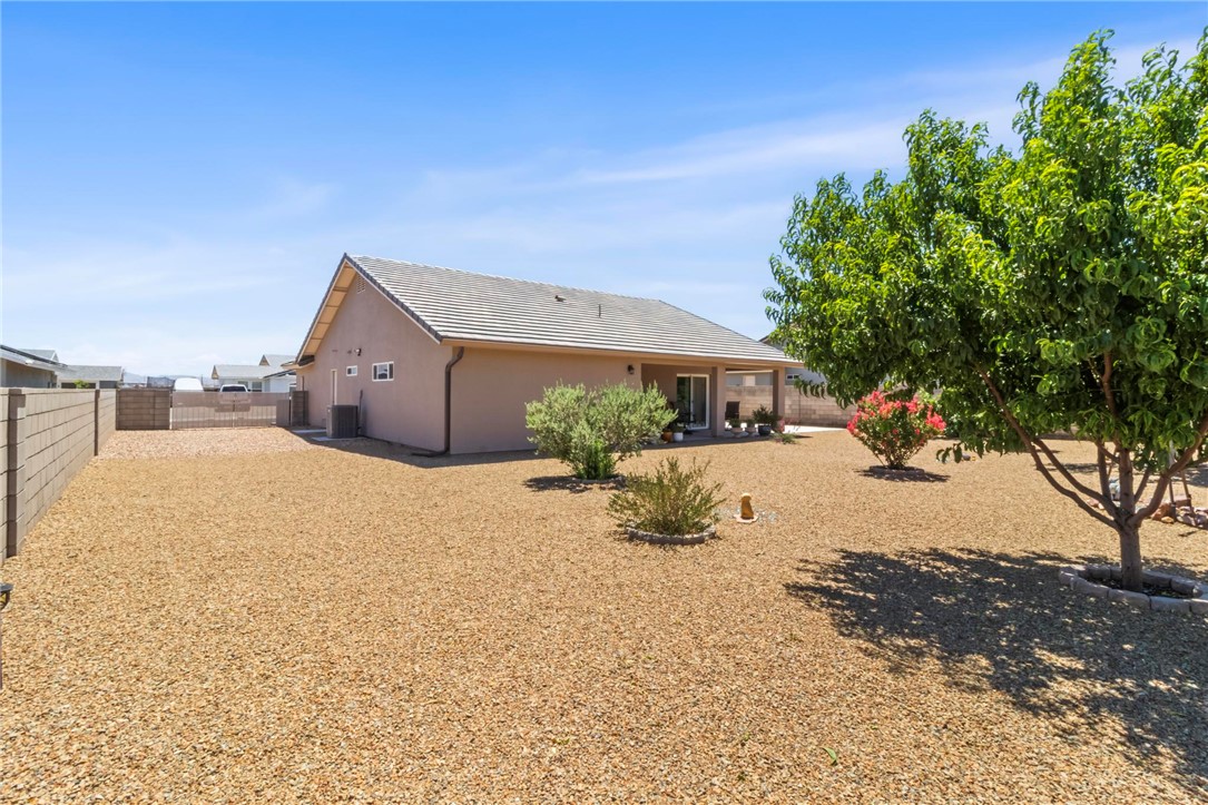 3897 Easy Street Kingman, AZ 86409 - Photo 37 of 53 a front view of a house with a yard and garage