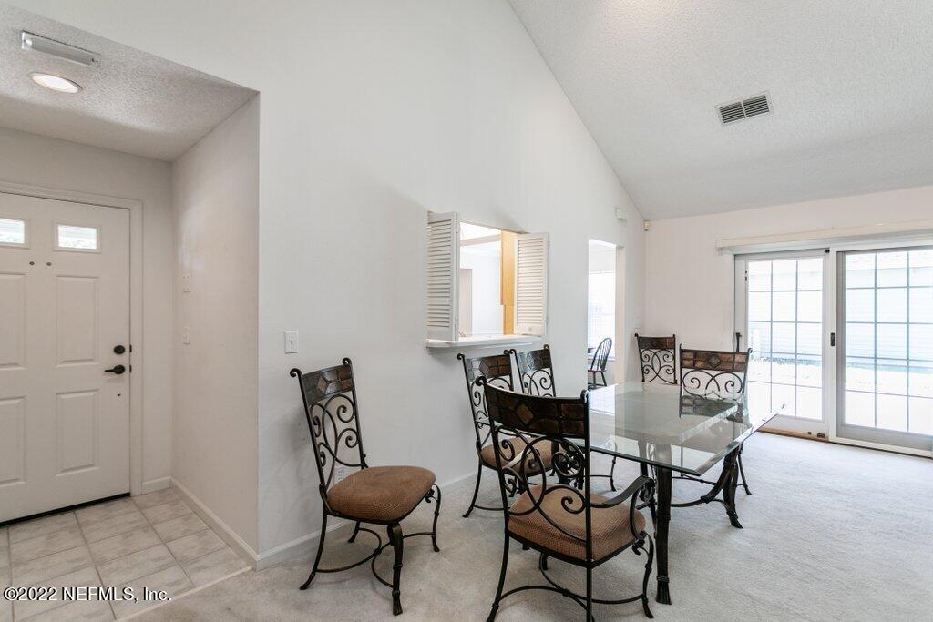 409 Village Drive St. Augustine, FL 32084 - Photo 11 of 75 a dining room with furniture and window