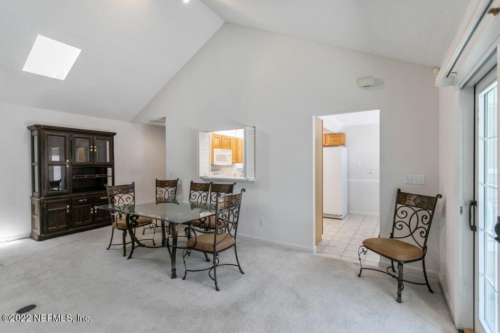 409 Village Drive St. Augustine, FL 32084 - Photo 12 of 75 a view of a livingroom with furniture and a flat screen tv