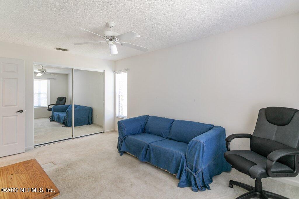 409 Village Drive St. Augustine, FL 32084 - Photo 24 of 75 a living room with furniture