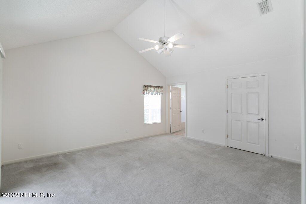 409 Village Drive St. Augustine, FL 32084 - Photo 25 of 75 a view of an empty room with a window