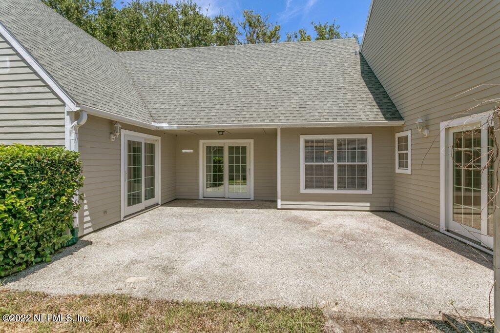 409 Village Drive St. Augustine, FL 32084 - Photo 34 of 75 front view of a house with a yard