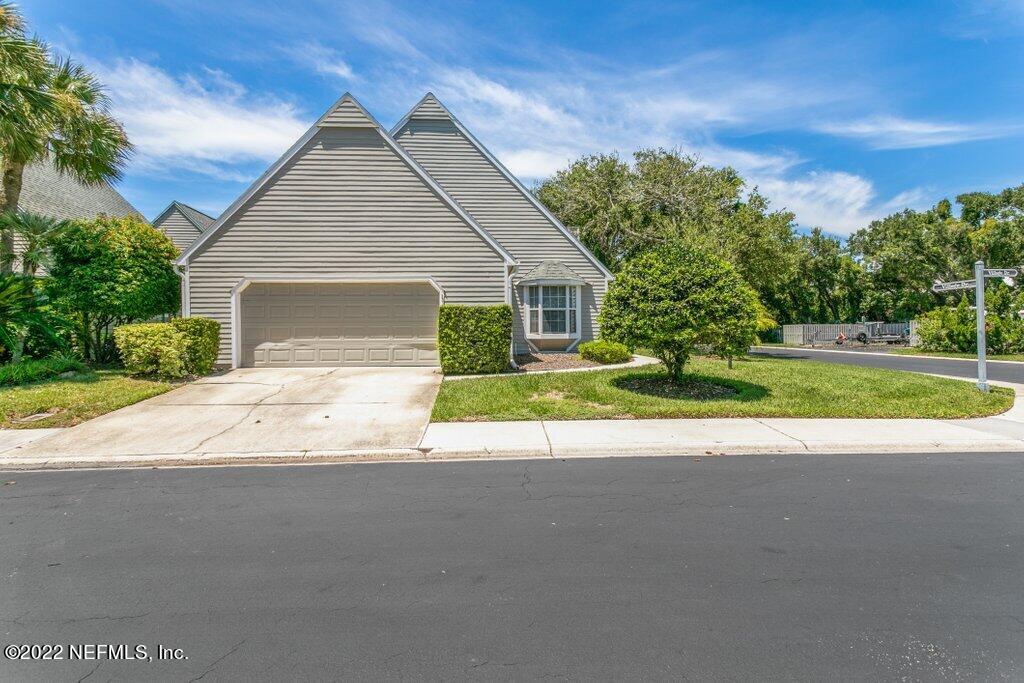 409 Village Drive St. Augustine, FL 32084 - Photo 42 of 75 a view of a house with a yard