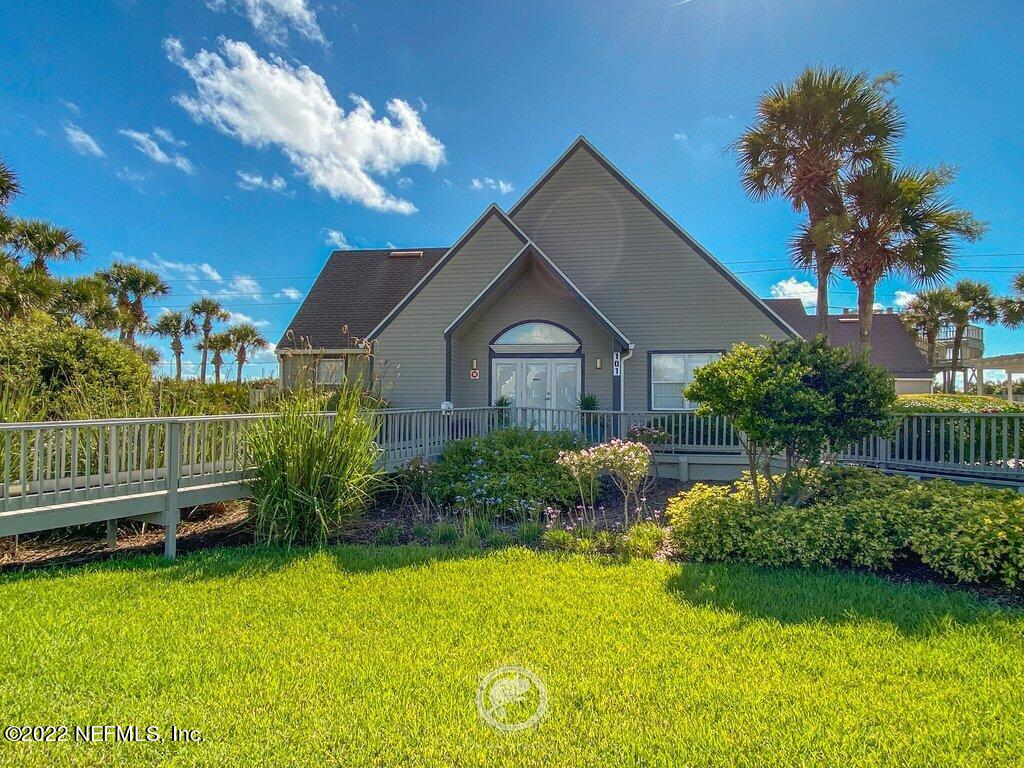 409 Village Drive St. Augustine, FL 32084 - Photo 63 of 75 a front view of a house with garden
