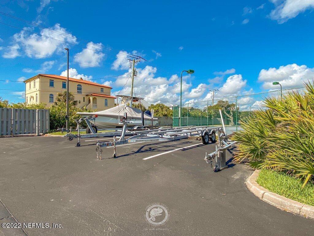 409 Village Drive St. Augustine, FL 32084 - Photo 68 of 75 a view of a street with a garage