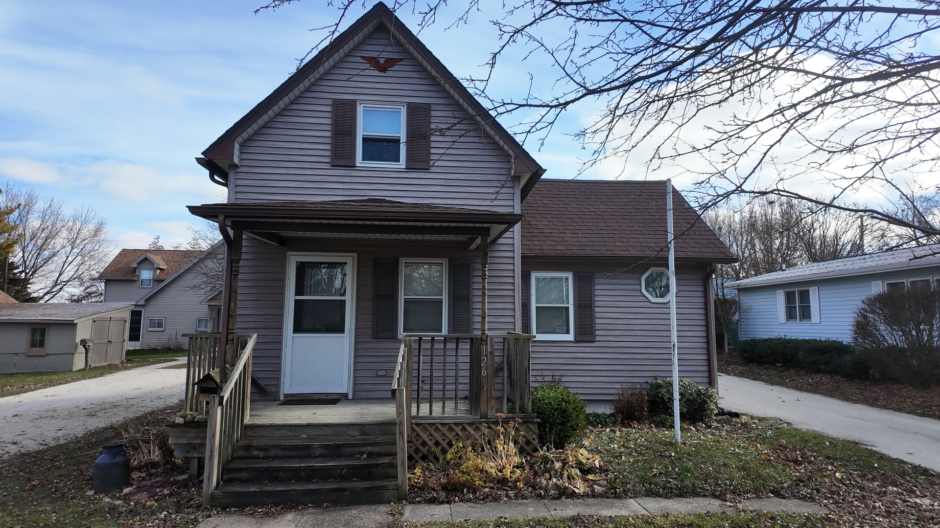 a front view of a house with stairs yard