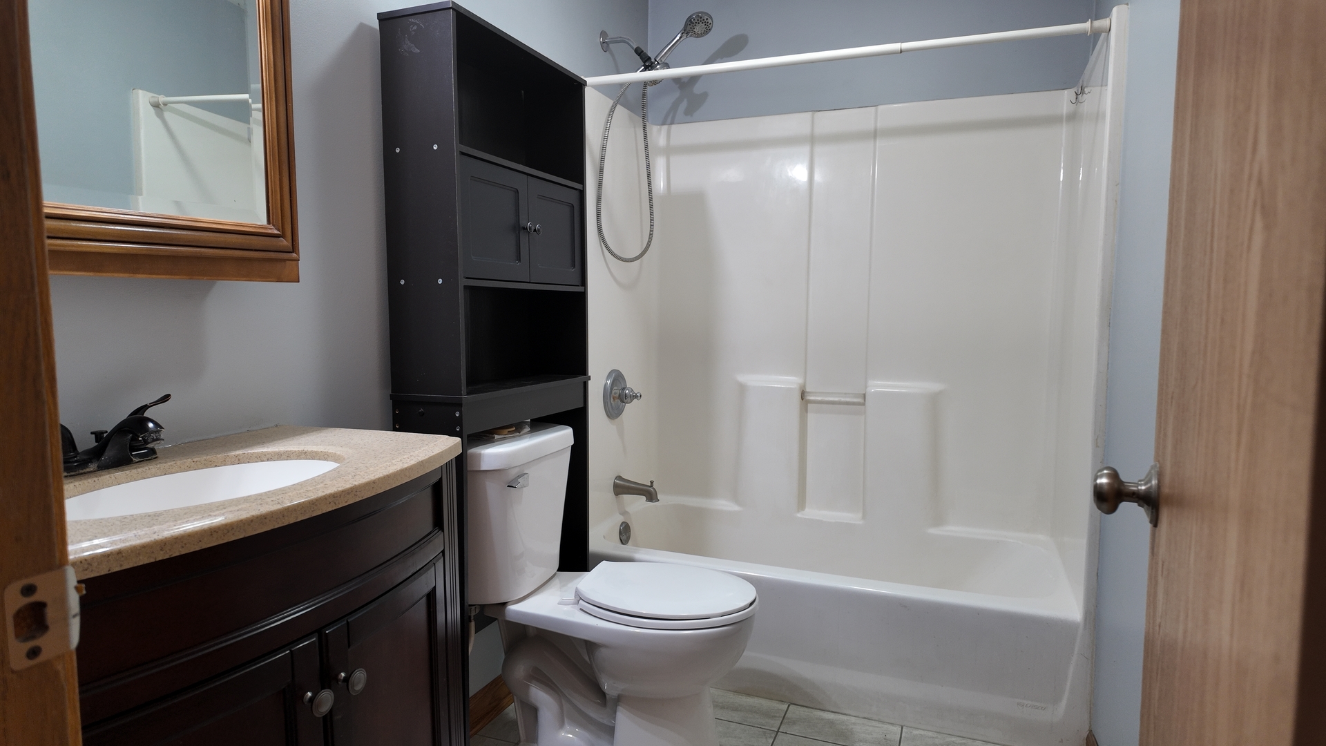 126 Prairie Street Genoa, IL 60135 - Photo 13 of 24 a bathroom with a sink a toilet and shower