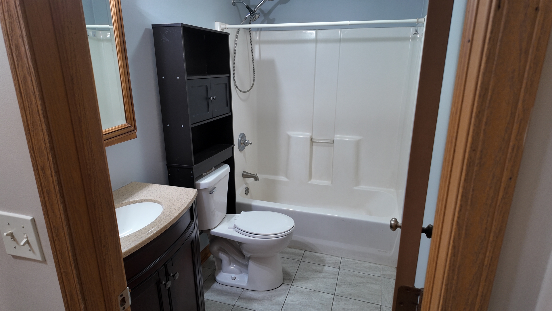 126 Prairie Street Genoa, IL 60135 - Photo 16 of 24 a bathroom with a granite countertop sink toilet and shower