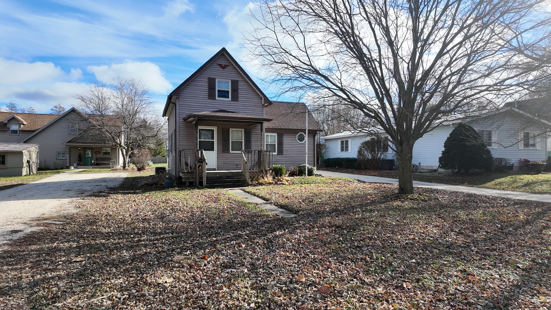 126 Prairie Street Genoa, IL 60135 - Photo 3 of 24 a front view of a house with a yard and garage