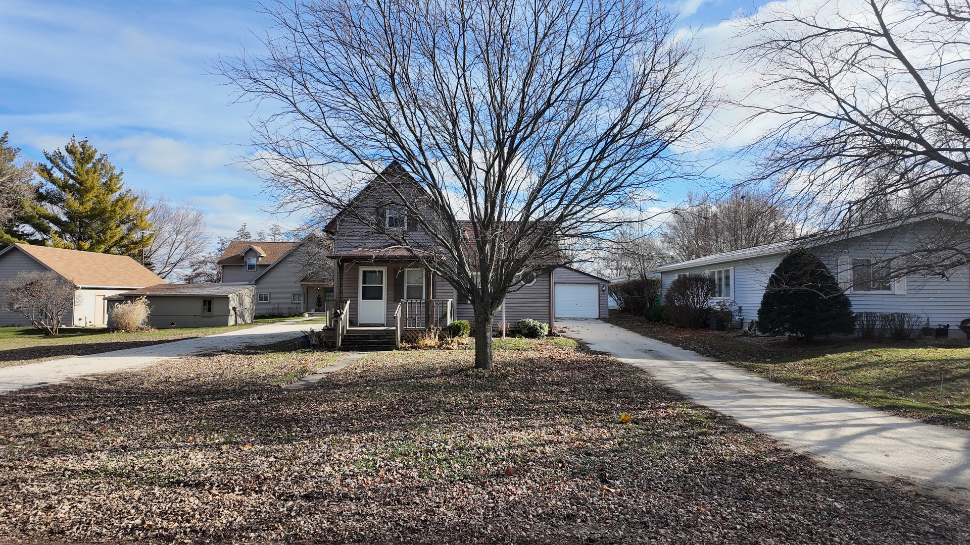 126 Prairie Street Genoa, IL 60135 - Photo 4 of 24 a front view of a house with a yard