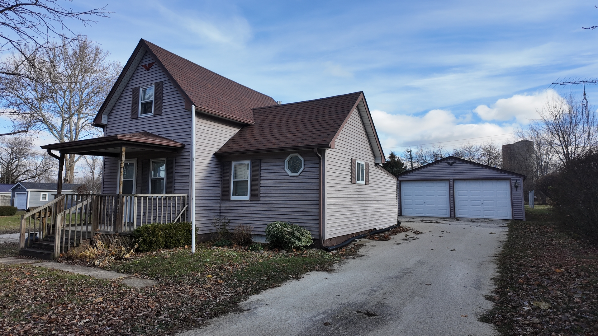126 Prairie Street Genoa, IL 60135 - Photo 6 of 24 a front view of a house with a yard and garage