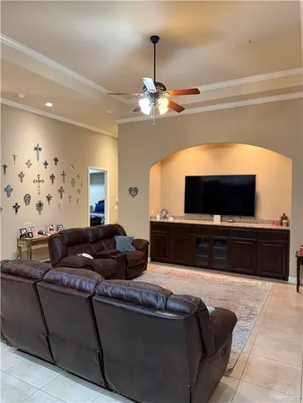a living room with furniture and a flat screen tv